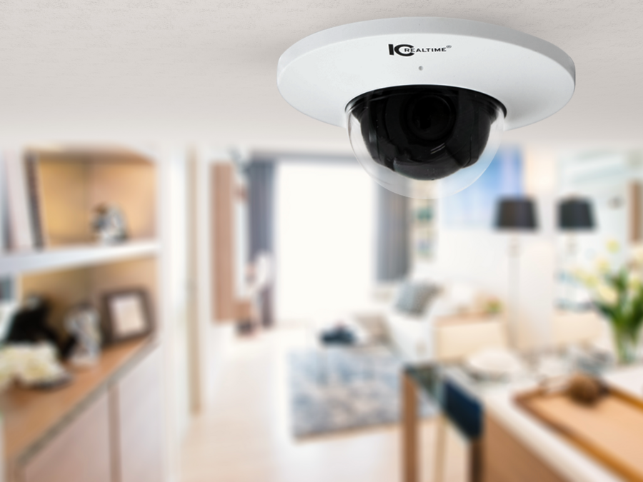 Closeup of a ceiling-mounted IC Realtime low profile dome camera. 
