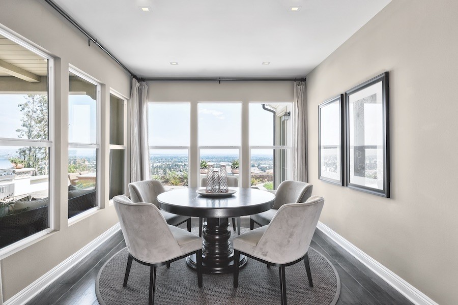 A dining room with Sonance invisible speakers installed in the ceiling.