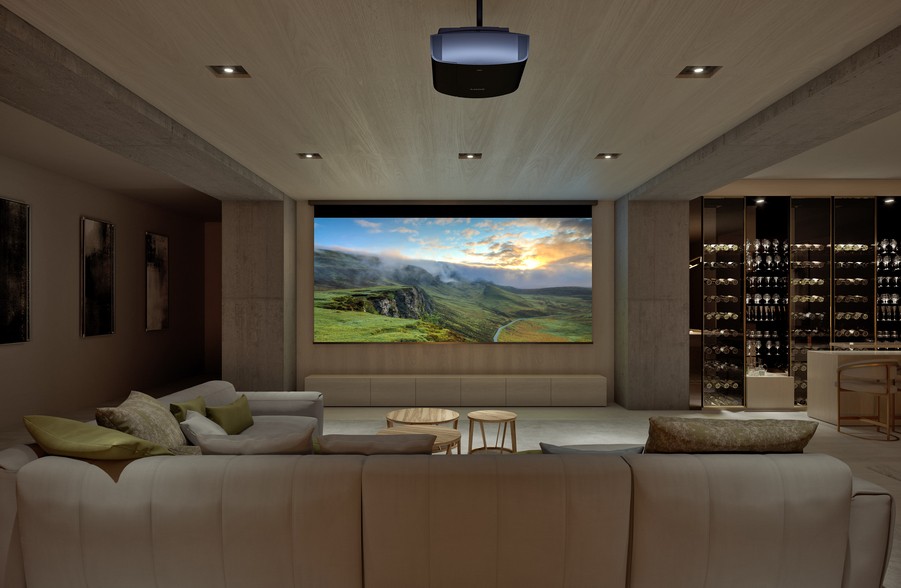 Elegant home entertainment setup in Iowa City with projector, large screen, cozy seating, and adjacent wine storage.