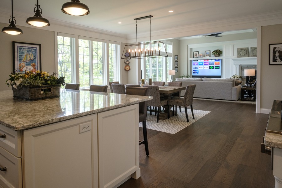 Open kitchen and living room with modern furnishings and abundant natural light.