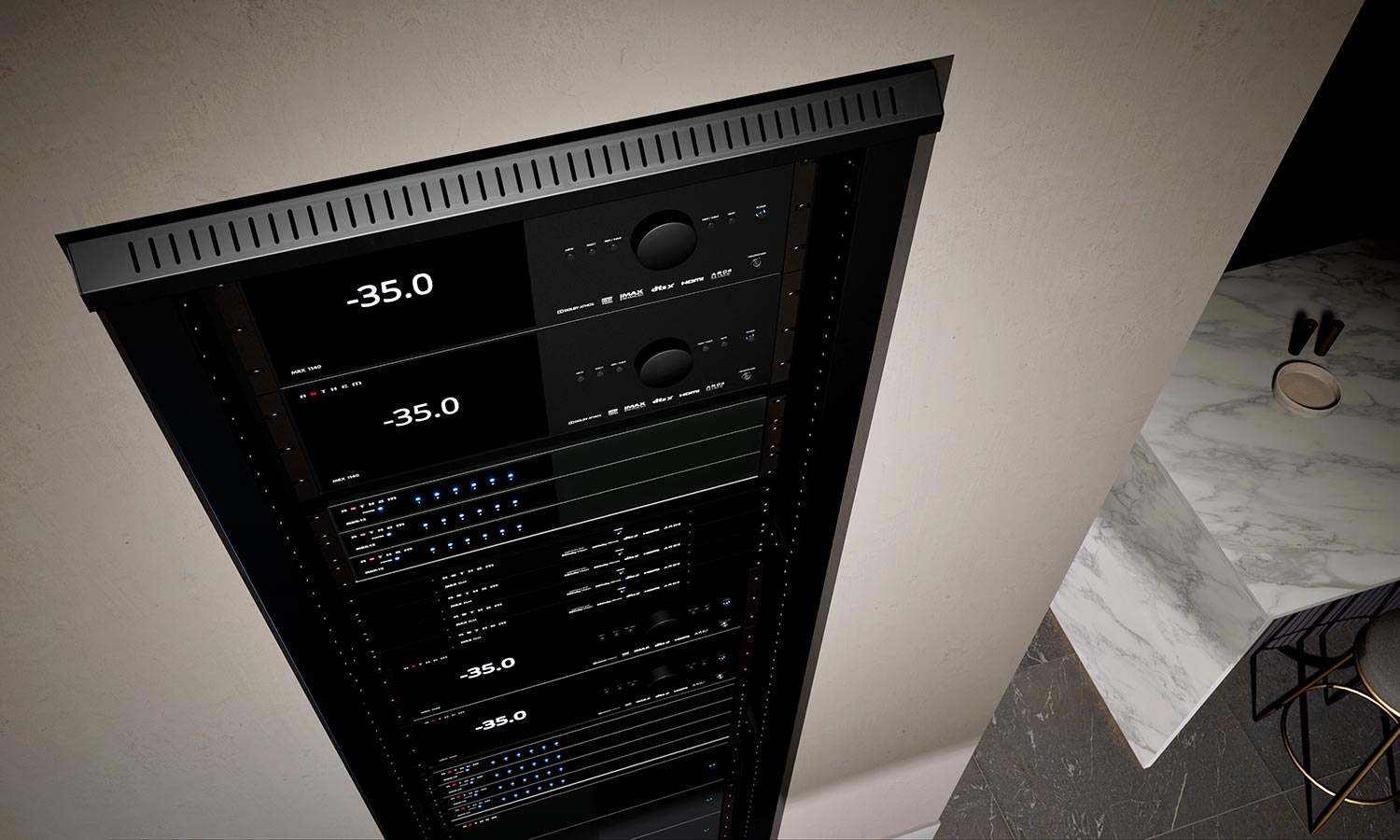Close-up of audio equipment rack with digital displays showing volume levels