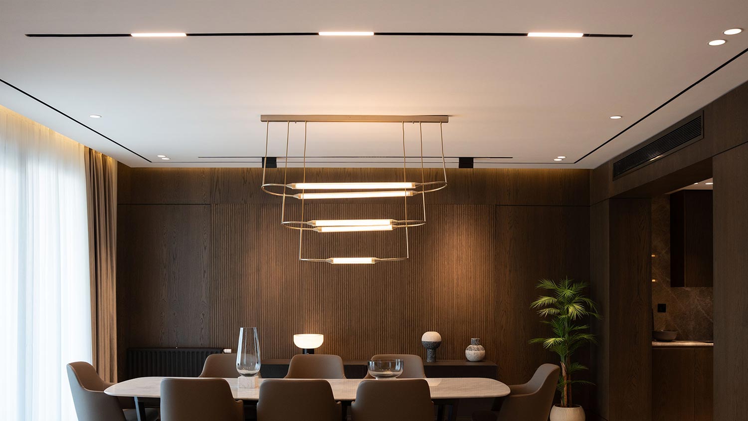 Modern dining room with sleek linear pendant lights